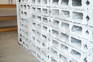 Rectangular thick concrete blocks are characterized by small pores scattered throughout the cube