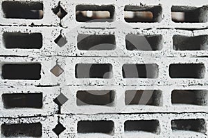 Rectangular thick concrete blocks are characterized by small pores scattered throughout the cube