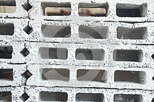 Rectangular thick concrete blocks are characterized by small pores scattered throughout the cube