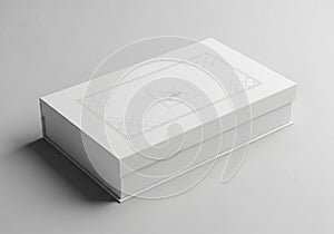 Rectangular white box on a light gray surface, featuring a minimalist design with geometric line
