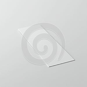 Rectangular white card or paper on a smooth, light gray background.