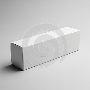 Rectangular white cardboard box placed on a neutral gray surface