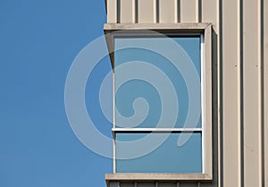 Rectangular windows on cream building facades