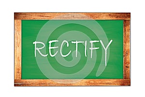 RECTIFY text written on green school board