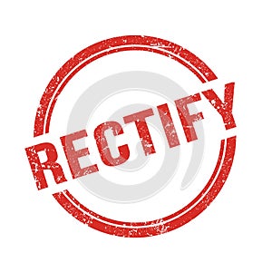RECTIFY text written on red grungy round stamp