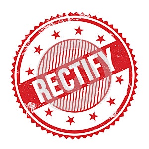 RECTIFY text written on red grungy round stamp