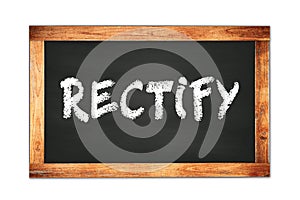 RECTIFY text written on wooden frame school blackboard