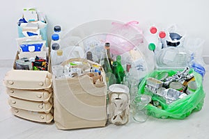 Recyclable garbage: glass, different plastic, paper, cardboard, metal prepared for recycling. Waste to be recycled. Trash for