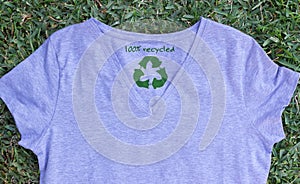 Recycle clothes icon on t shirt with 100% Recycled text, concept illustration reuse, recycle clothes and textiles to reduce waste