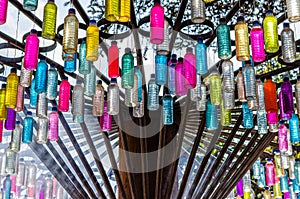 Recycle concept, colorful plastic bottles hanging like merry go round