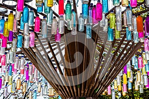 Recycle concept, colorful plastic bottles hanging like merry go round