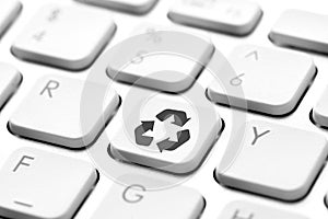 Recycle icon on computer keyboard for green and eco concept