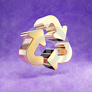 Recycle icon. Gold glossy Recycle symbol isolated on violet velvet background.