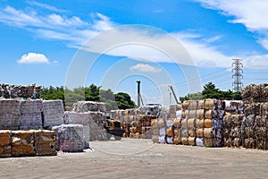 The recycle industry cardboard garbage and paper waste after pressing in hydraulic baling garbage press machine to a square dense