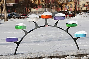 Recycle, reuse resources. Interesting support for flowers, made from used tires, brightly colored. photo