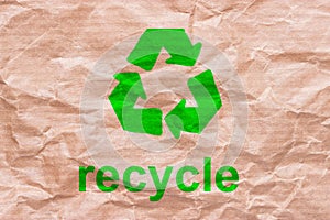 Recycle sign on wrapping paper