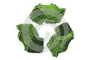 Recycle symbol covered by grass