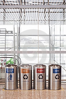 Recycle trashcans at a departures terminal of an airport