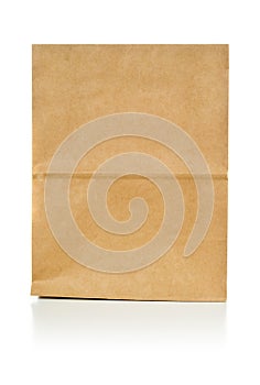 Recycled brown paper doggy bag over white background