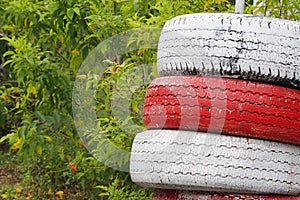 Recycled Car tires painted red and white Is a traffic symbol no parking