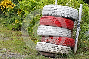 Recycled Car tires painted red and white Is a traffic symbol no parking