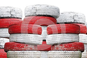 Recycled Car tires painted red and white Is a traffic symbol no parking.which isolated on a white background