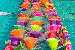 Recycled colorful plastic flowers made from plastic bottles to decorate as flowers in the garden.
