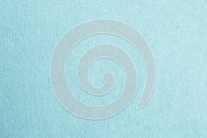 Recycled craft paper textured background in light cyan blue color