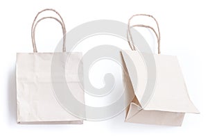 Recycled paper bags on white background