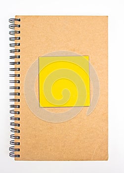 Recycled Paper Notebook Front Cover With Yellow Sticky Note.