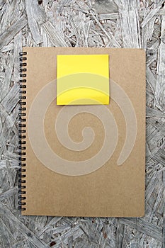 Recycled paper notebook on wood