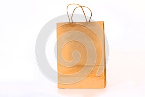 Recycled paper shopping one beige bag on white background.