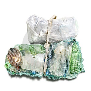 Recycled plastic bottles in mesh in package isolated on white background