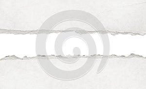 Recycled white torn horizontal note paper texture, light background.