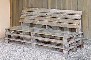 Recycled wood palet make sit bench on home garden