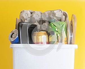 Recycling bin full of recyclable things .