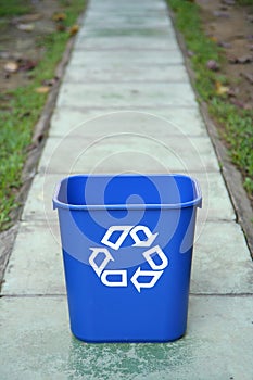 Recycling bin in the middle of a path