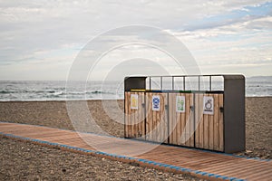 Recycling bins on the beach photo