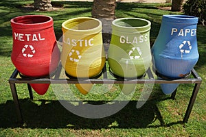 Recycling bins. Containers with separated garbage. Trash cans for plastic, glass, paper and organic. Segregate waste. Garbage
