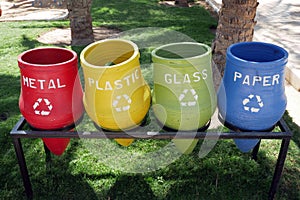 Recycling bins. Containers with separated garbage. Trash cans for plastic, glass, paper and organic. Segregate waste. Garbage