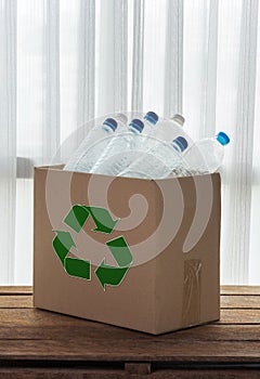 Recycling box filled with clear plastic containers