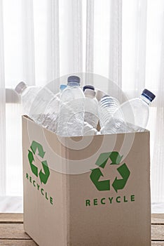 Recycling box filled with clear plastic containers