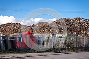 Recycling centre from behind a fence.