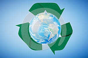 Recycling. Eco recycling green symbol. Recycling sign on the background of the globe. 3d render