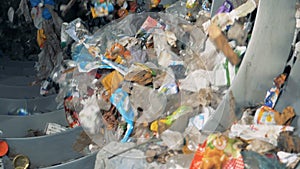 Recycling equipment works at a factory, close up.