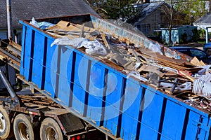 recycling garbage collector truck loading waste and removable container.