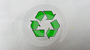 Recycling icon on a waste blank packaging paper