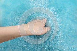 Recycling material of papers. Paper in blue water. Woman hand with recycling paper in water. Selective and soft focus