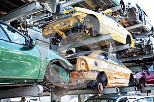 Recycling of old,used, wrecked cars. Dismantling for parts at scrap yards photo