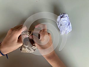 Recycling paper for art and crafts activity during an art lab at school_ children hands creating, learning by doing